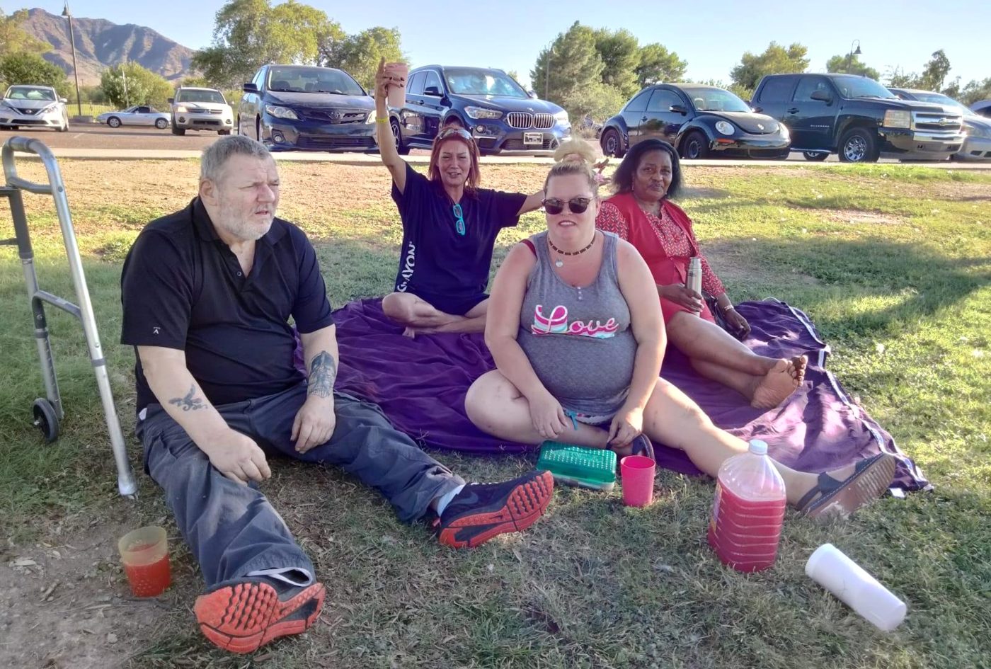 Community members sharing an afternoon picnic in a Phoenix-area park